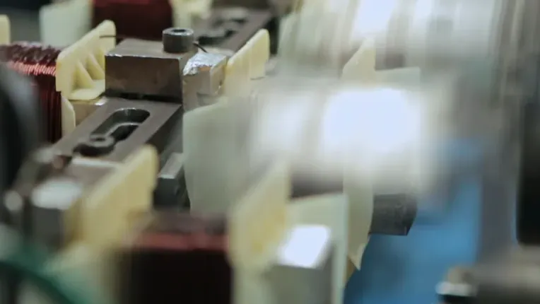 Wound copper coils moving along a production line